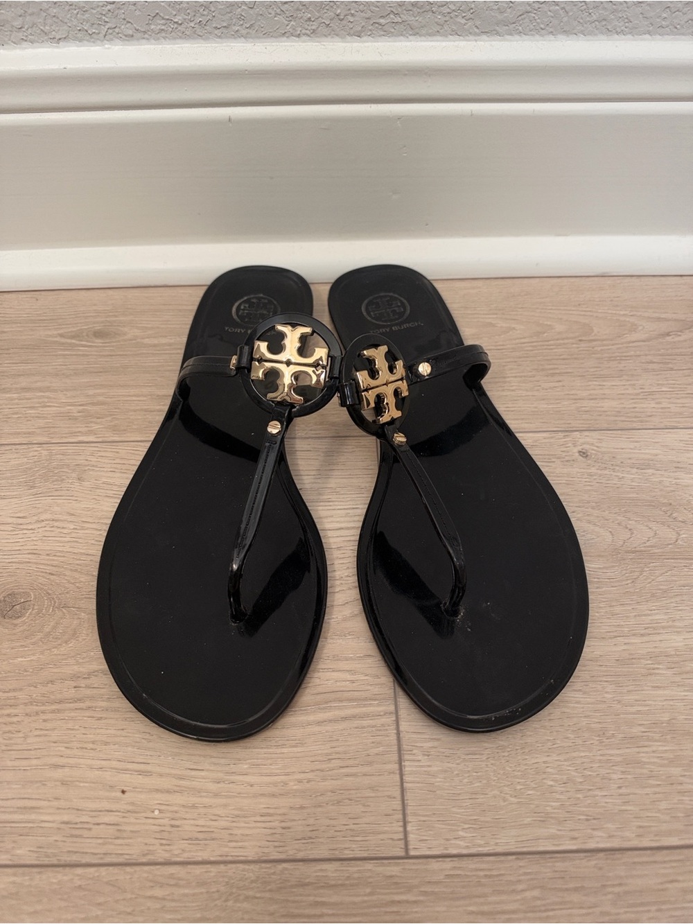 Tory Burch Black Patent Thong Sandals with Gold Logo Medallions